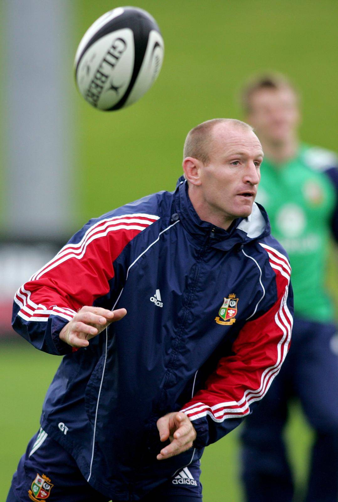 FILE PHOTO: British and Irish Lions captain Gareth Thomas flicks a pass out during Lions training in Auckland