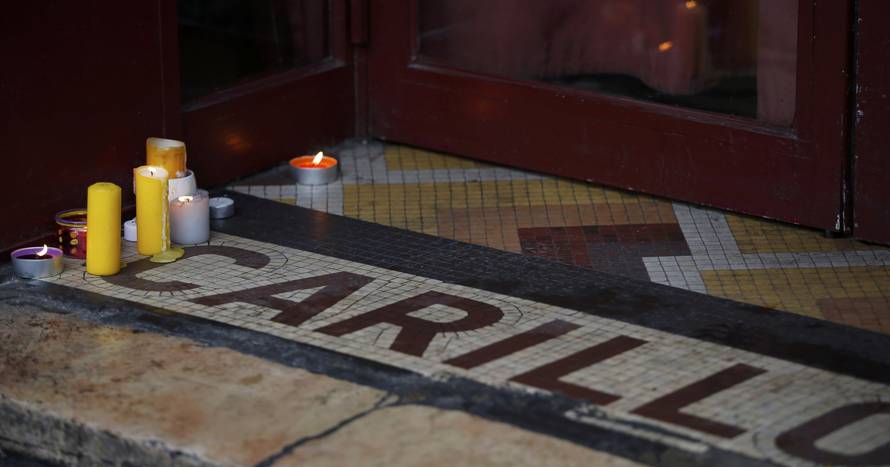 Candles are seen on the entrance of the "Le Carillon" bar and restaurant in Paris