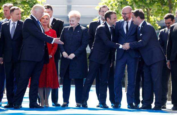 U.S. President Donald Trump and NATO member leaders gather for a family picture before the start of their summit at the new headquarters in Brussels