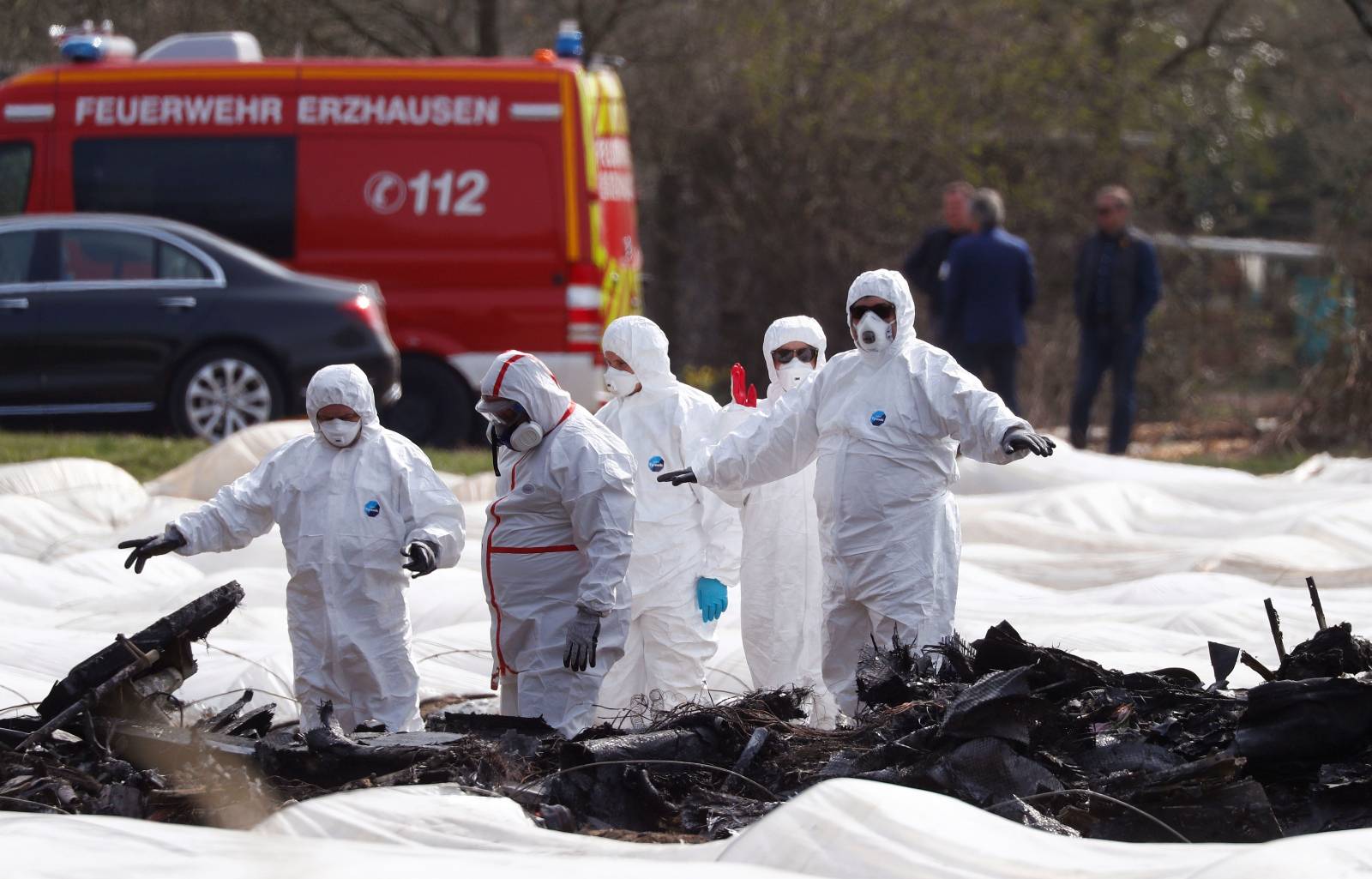 Experts from Germany and Russia inspect the wreckage of an Epic1000 plane in which Natalia Fileva, co-owner and chairwoman of Russia's second largest airline S7, was killed after the plane crashed in Erzhausen near Frankfurt