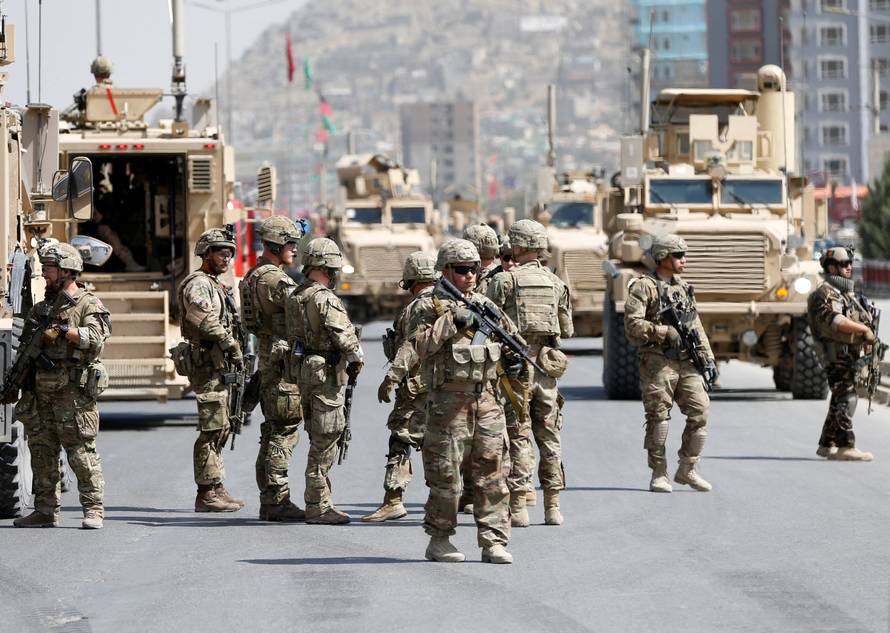 U.S. and NATO troops arrive at the site of a car bomb attack in Kabul, Afghanistan