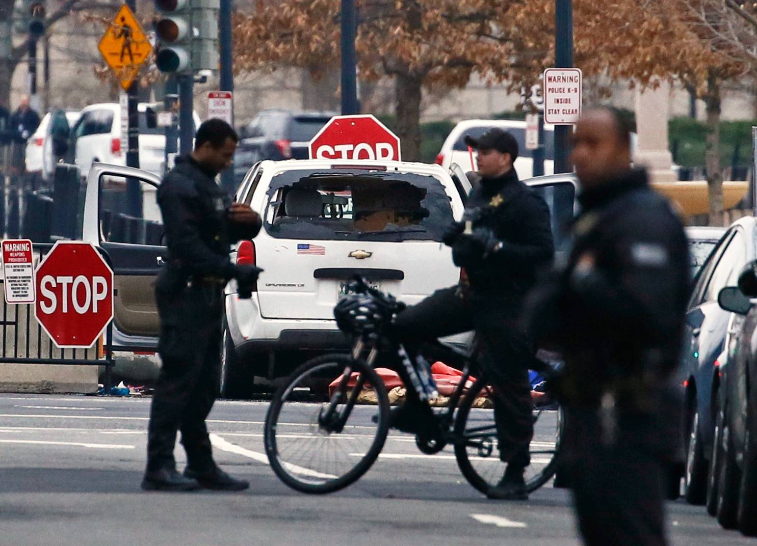 A passenger vehicle that struck a security barrier sits near the White House in Washington