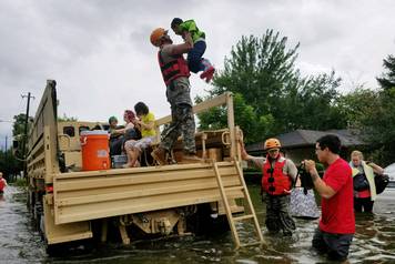 Handout photo of Texas National Guard soldiers aiding residents in heavily flooded areas from the storms of Hurricane Harvey in Houston