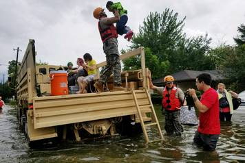 Handout photo of Texas National Guard soldiers aiding residents in heavily flooded areas from the storms of Hurricane Harvey in Houston