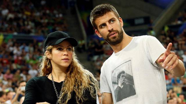 FILE PHOTO: Colombian singer Shakira and her partner, Barcelona soccer player Pique, attend the Basketball World Cup quarter-final game between the U.S. and Slovenia in Barcelona