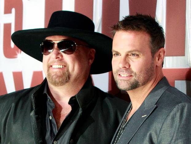 FILE PHOTO:    Country music duo Montgomery Gentry arrives at the 45th Country Music Association Awards in Nashville
