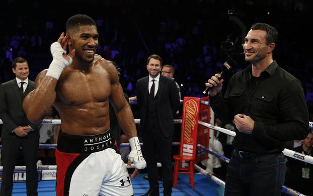 Anthony Joshua celebrates his win with Wladimir Klitschko