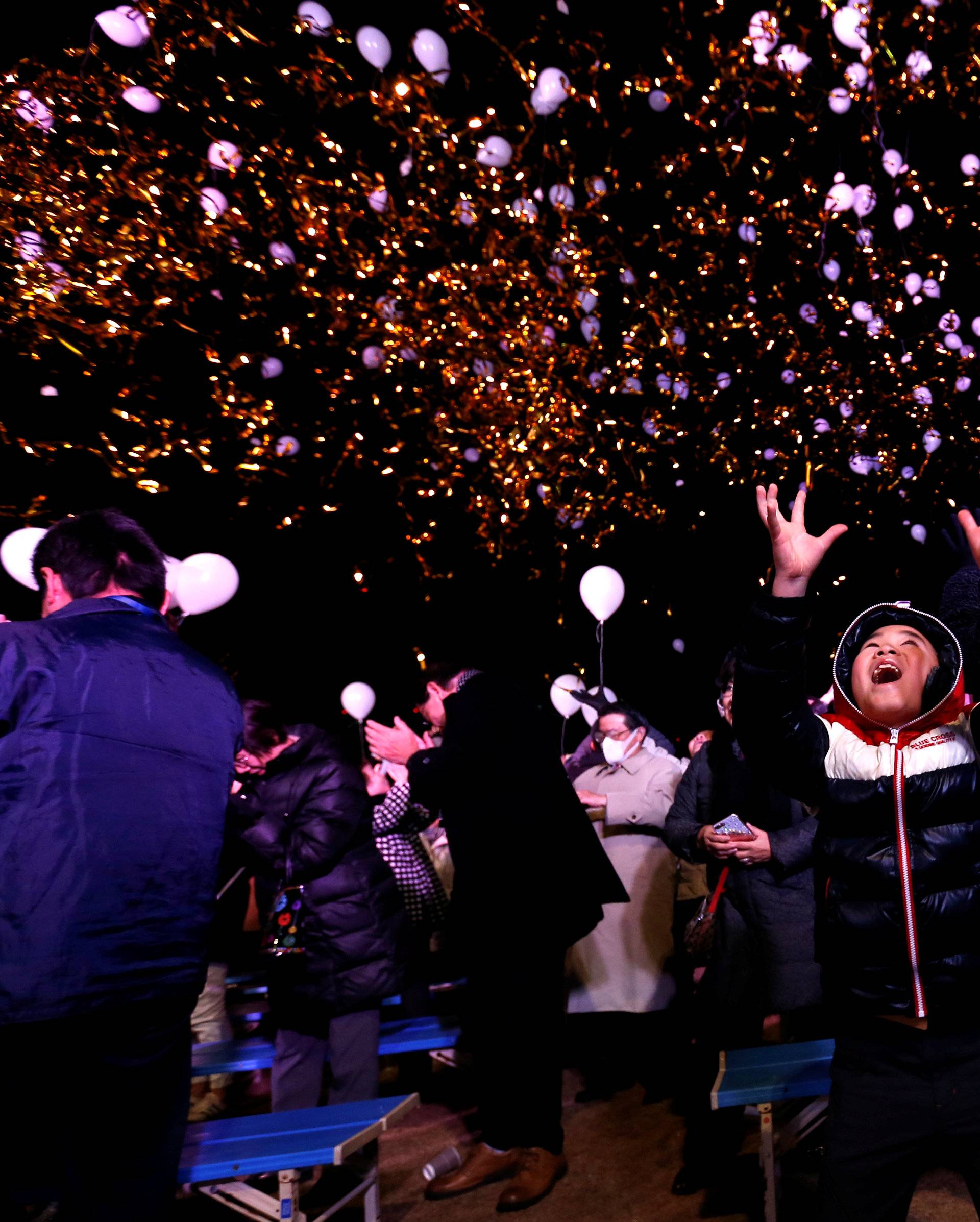 Revellers release balloons as they take part in New Year celebrations in Tokyo, Japan