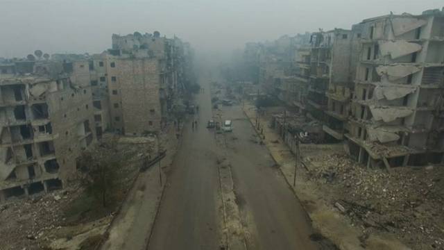 A still image from video taken December 13, 2016 of a general view of bomb damaged eastern Aleppo, Syria in the rain