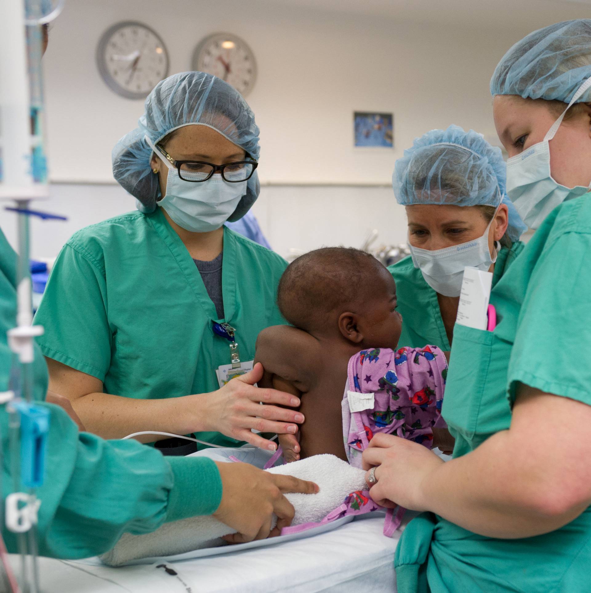 Hospital staff prepare 10-month old "Baby Dominique" for surgery to treat the infant born with four legs and two spines at Advocate Children's Hospital in Park Ridge, Illinois