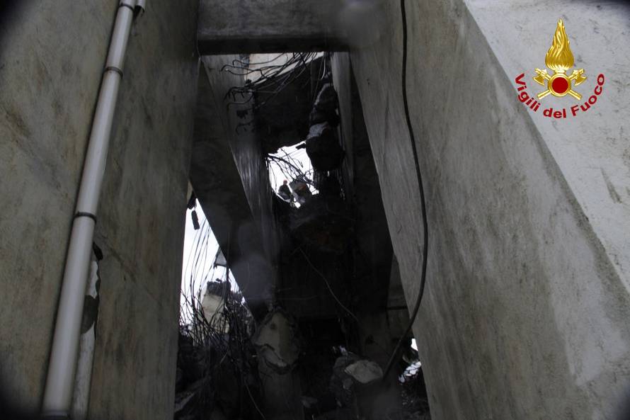 The collapsed Morandi Bridge is seen in the Italian port city of Genoa in this picture released by Italian firefighters