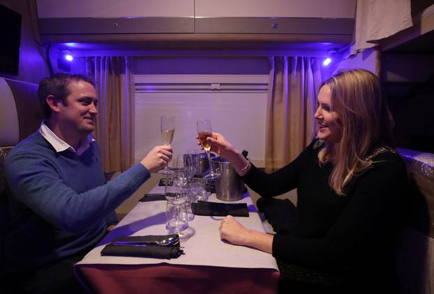 Customers enjoy dinner sitting inside a motorhome camper parked at the Belgian restaurant Matthias And Sea, despite the COVID-19 pandemic lockdown in Tarcienne