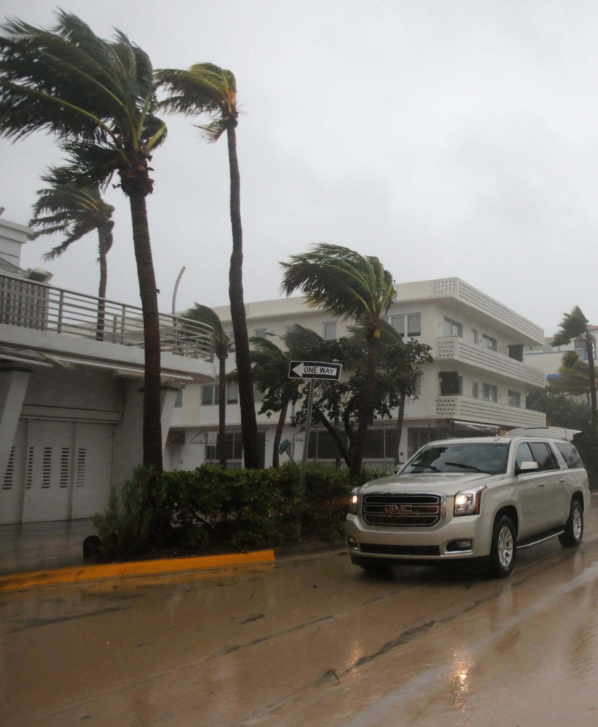 A vehicle drives along Ocean Drive in South Beach as Hurricane Irma arrives at south Florida, in Miami Beach