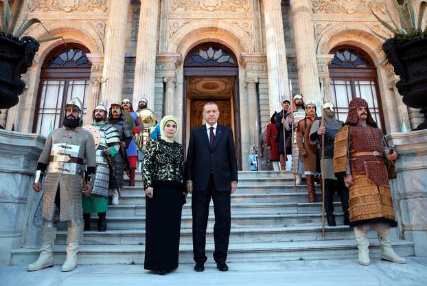 Turkish President Tayyip Erdogan, accompanied by his wife Emine Erdogan, is pictured at Dolmabahce Palace before a dinner for participants of World Humanitarian Summit in Istanbul