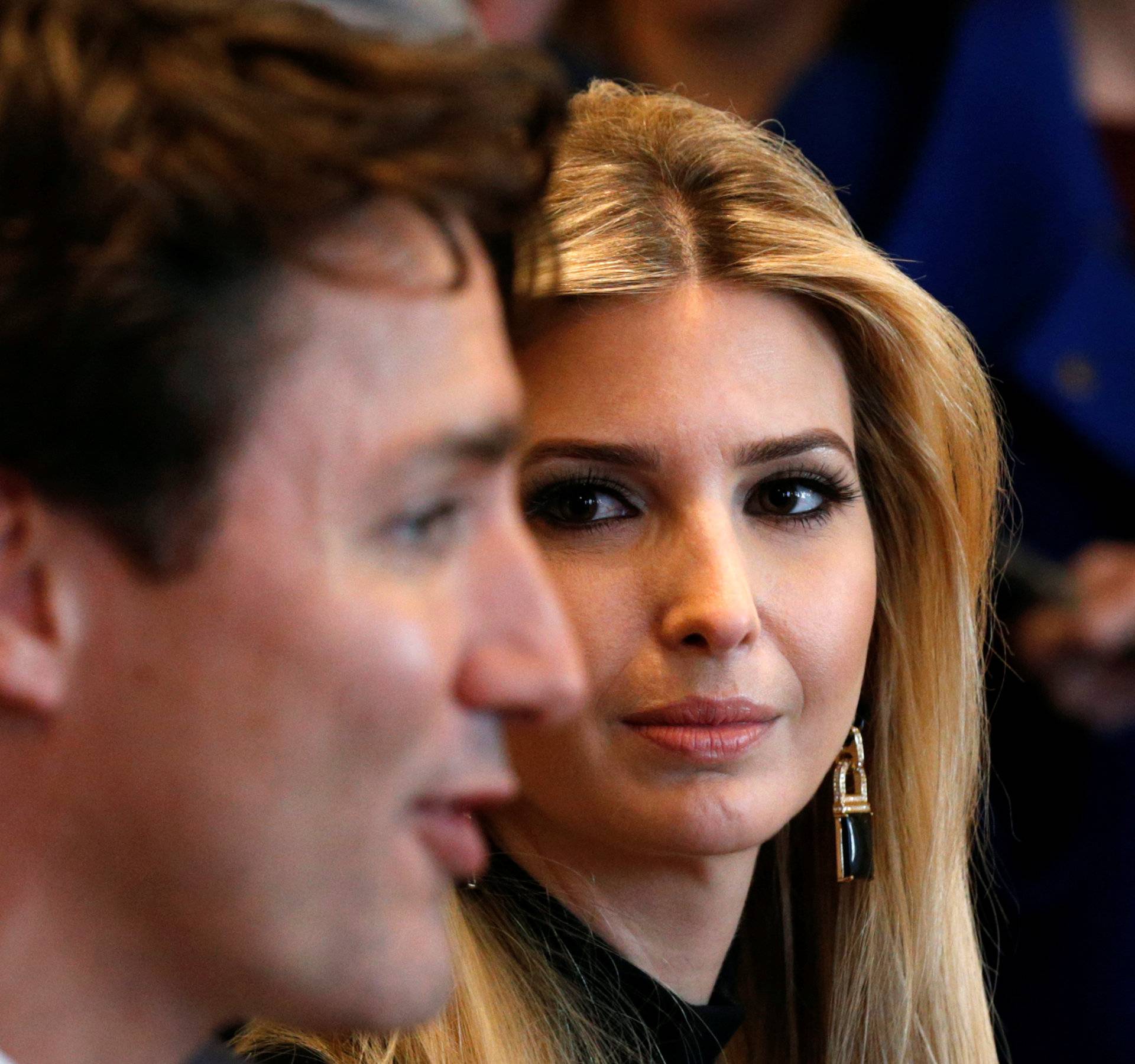 Ivanka Trump looks at Canadian Prime Minister Justin Trudeau during U.S. President Donald Trump's roundtable discussion on the advancement of women entrepreneurs and business leaders at the White House in Washington