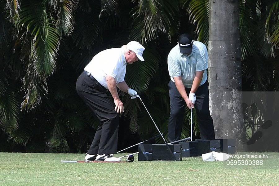 * PREMIUM EXCLUSIVE * Former President Donald Trump takes to the driving range before enjoying a round of golf