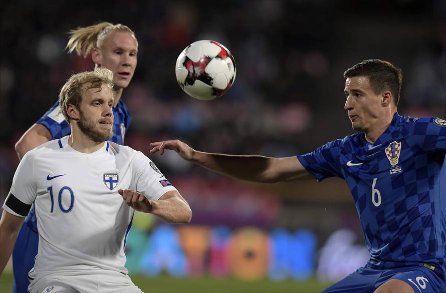 Teemu Pukki of Finland and Vida Domagoj and Matej Mitrovic of Croatia fight for the ball during the FIFA World Cup 2018 football qualification match between Finland and Croatia in Tampere