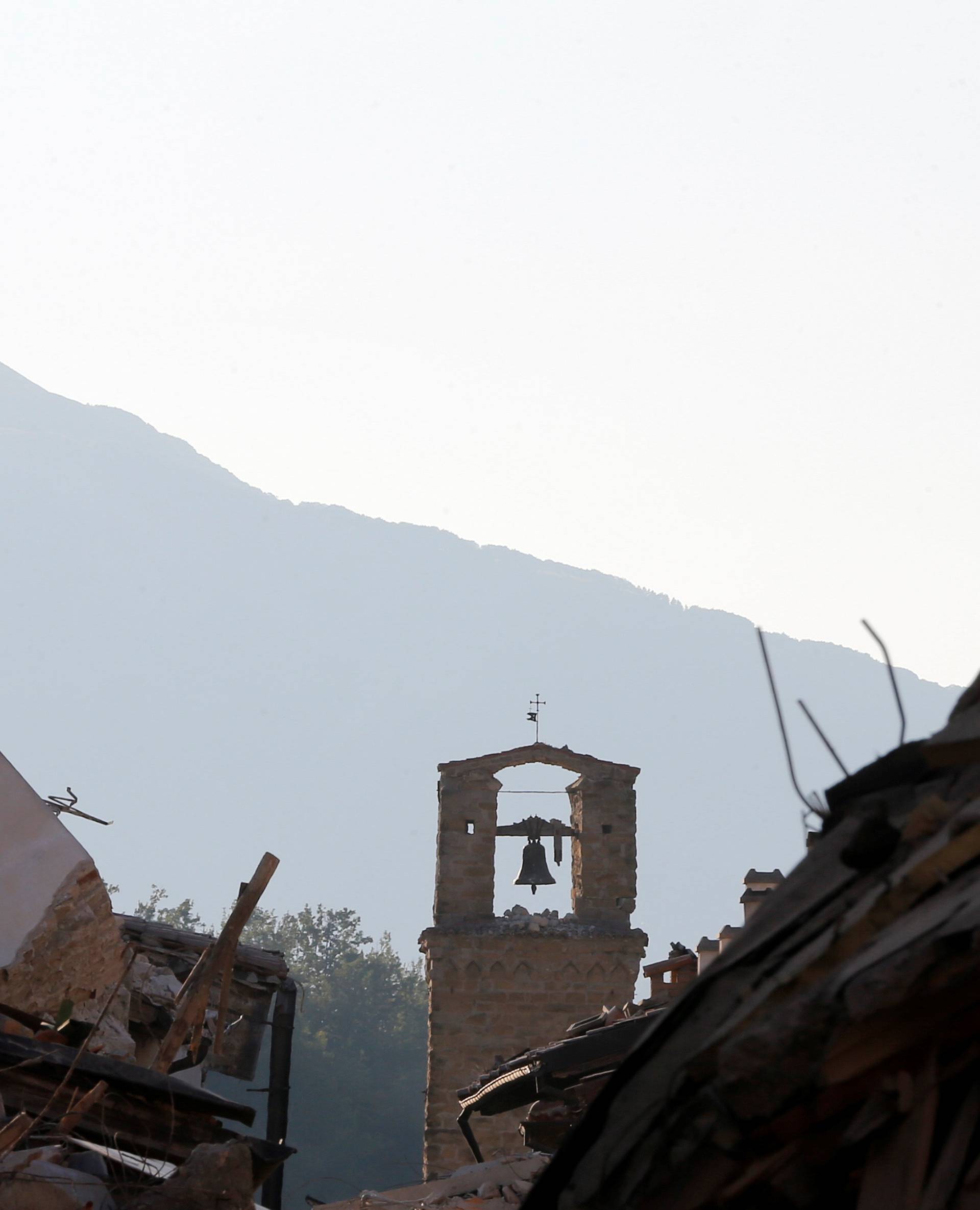 A tower bell is seen following an earthquake in Amatrice