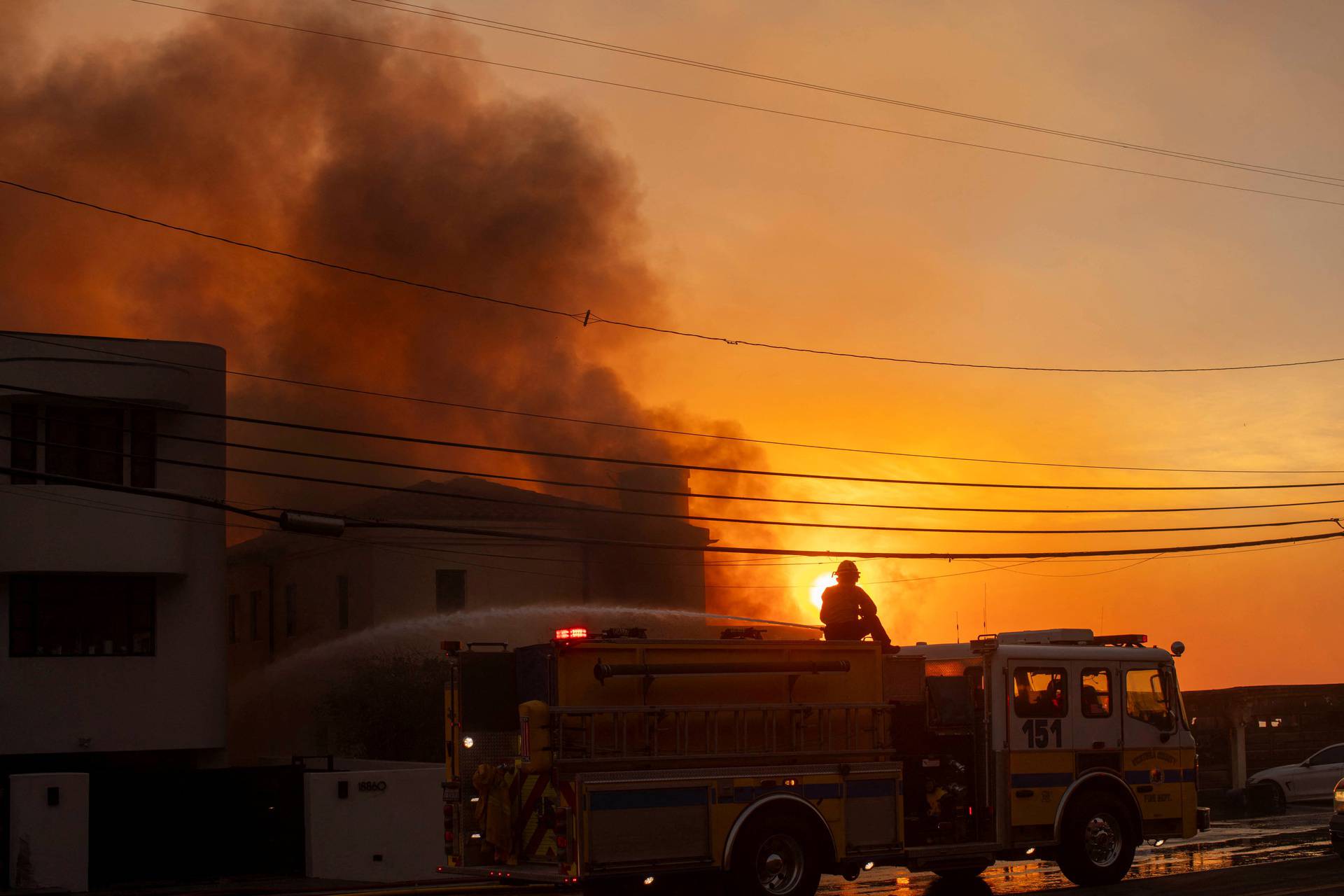 Palisades fire burns during a windstorm on the west side of Los Angeles