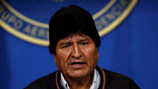 Bolivia's President Evo Morales addresses the media at the presidential hangar in the Bolivian Air Force terminal in El Alto