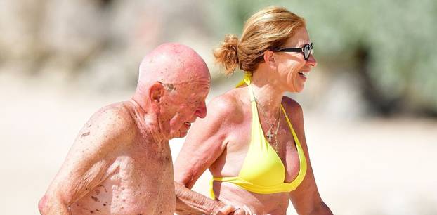 *PREMIUM-EXCLUSIVE* *MUST CALL FOR PRICING* The Australian-American business magnate Rupert Murdoch laps up the hot Caribbean sunshine with his scantily-clad mystery woman and billionaire pal Anthony Bamford out on the beaches of Barbados.