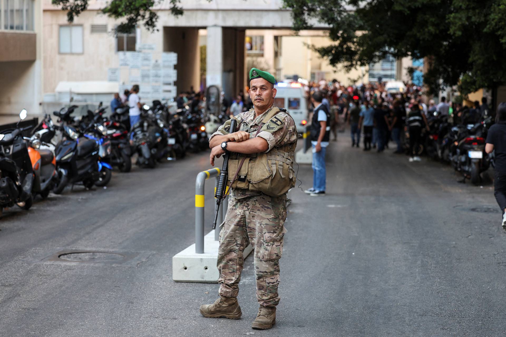 People gather outside a hospital, as more than 1,000 people, including Hezbollah fighters and medics, were wounded on Tuesday when the pagers they use to communicate exploded across Lebanon, according to a security source, in Beirut