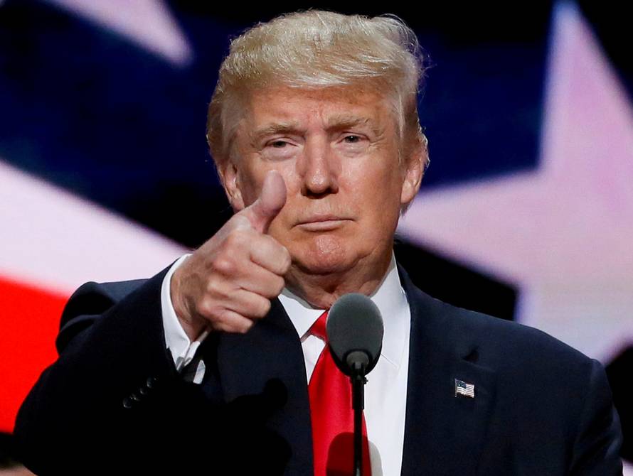 FILE PHOTO: FILE PHOTO: Republican presidential nominee Donald Trump gives a thumbs up as his campaign manager Paul Manafort looks on during Trump's walk through at the Republican National Convention in Cleveland