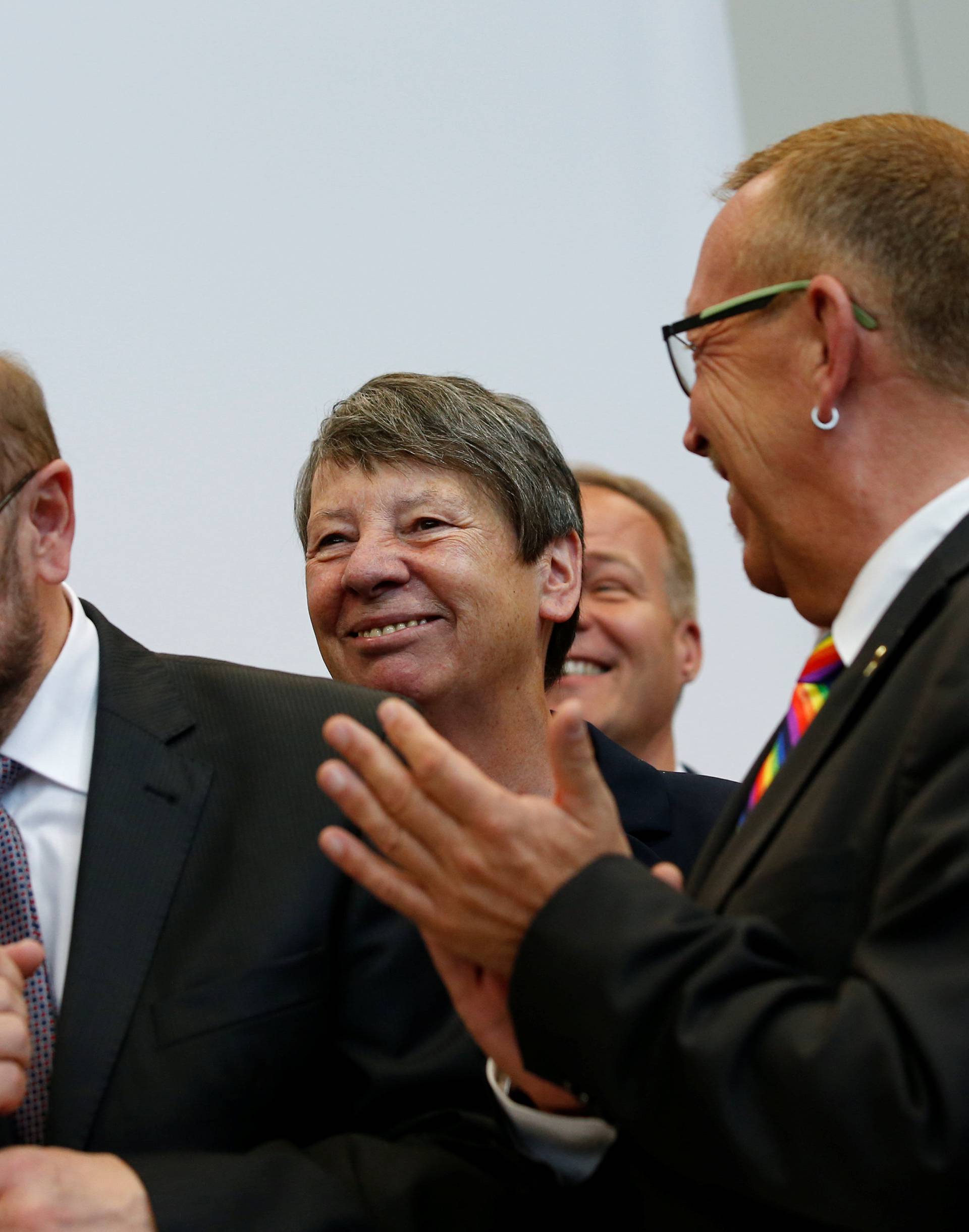 Martin Schulz and Barbara Hendricks of the SPD celebrate after a session of the lower house of parliament Bundestag voted on legalising same-sex marriage, in Berlin