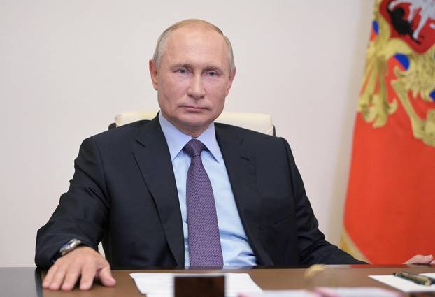 FILE PHOTO: Russia's President Putin attends the launching ceremony of the new Euro+ combined oil refining unit at the Gazprom Neft Moscow Refinery, via video link outside Moscow