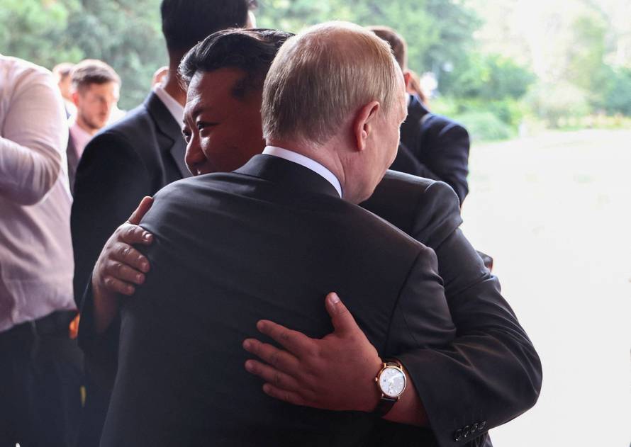Russian President Vladimir Putin meets with North Korean leader Kim Jong Un in Beijing
