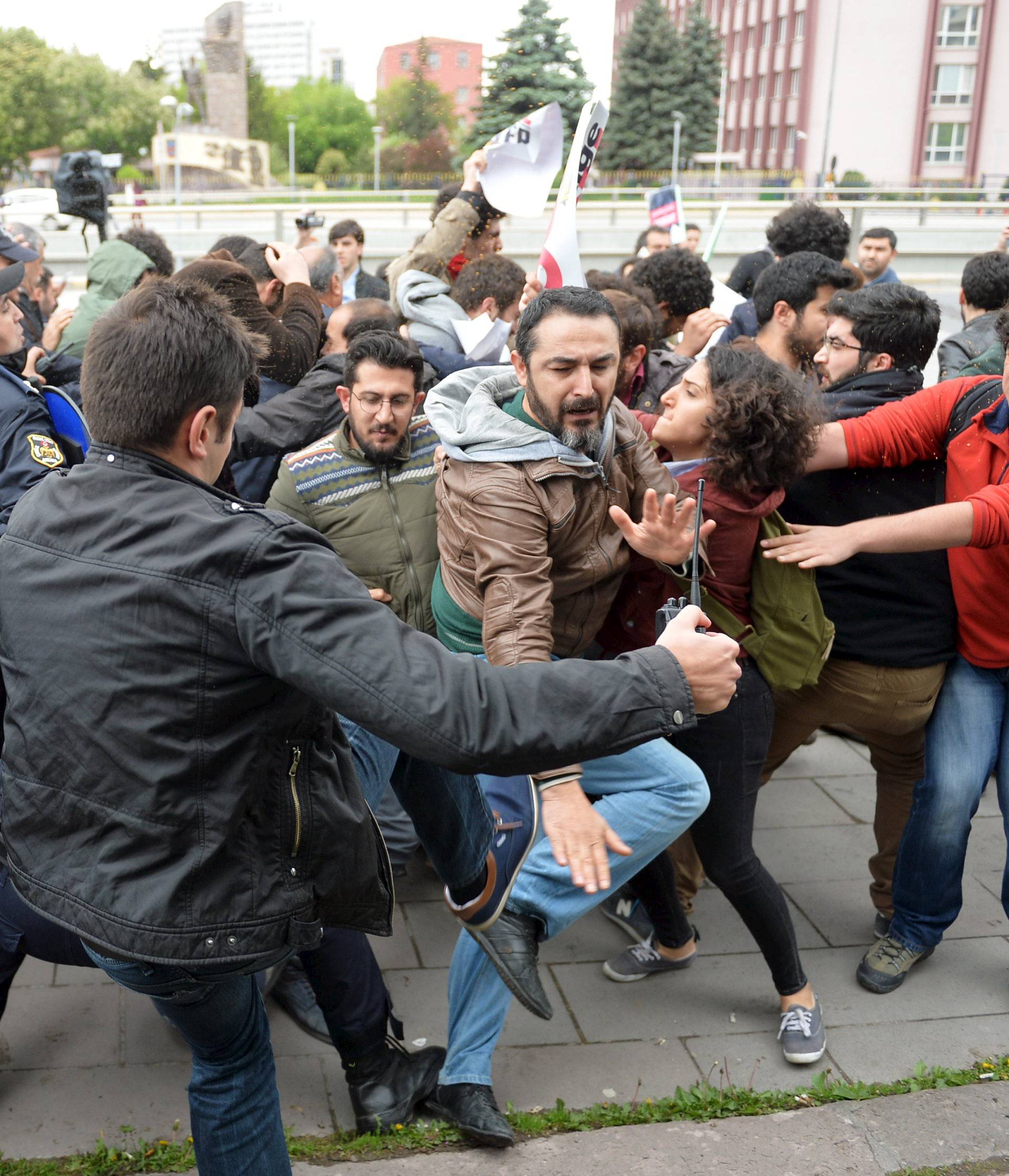 Riot police use tear gas to disperse demonstrators during a protest against parliament speaker Ismail Kahraman, outside the Turkish parliament in Ankara