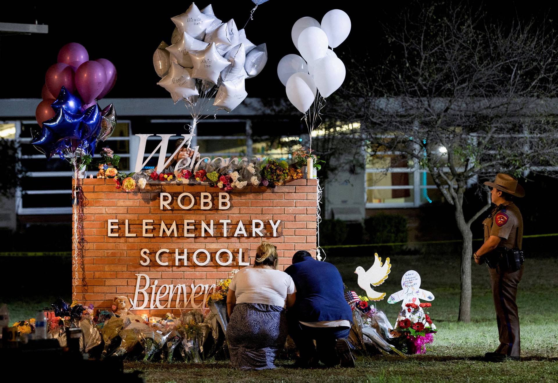 FILE PHOTO: People react after a mass shooting at Robb Elementary School in Uvalde