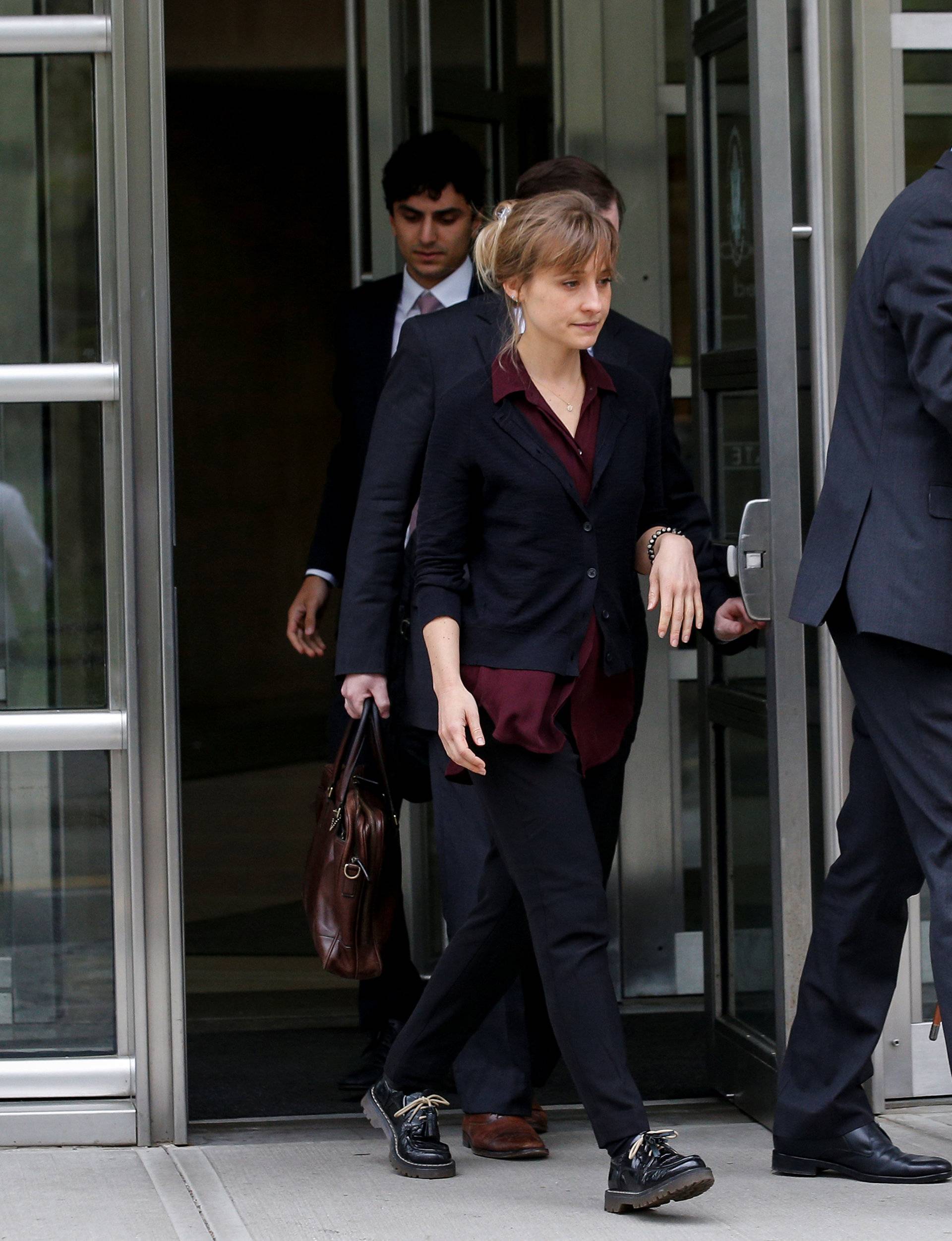 Actor Allison Mack, known for her role in the TV series 'Smallville', exits with her lawyers following a hearing on charges of sex trafficking in relation to the Albany-based organization Nxivm at United States Federal Courthouse in Brooklyn, New York