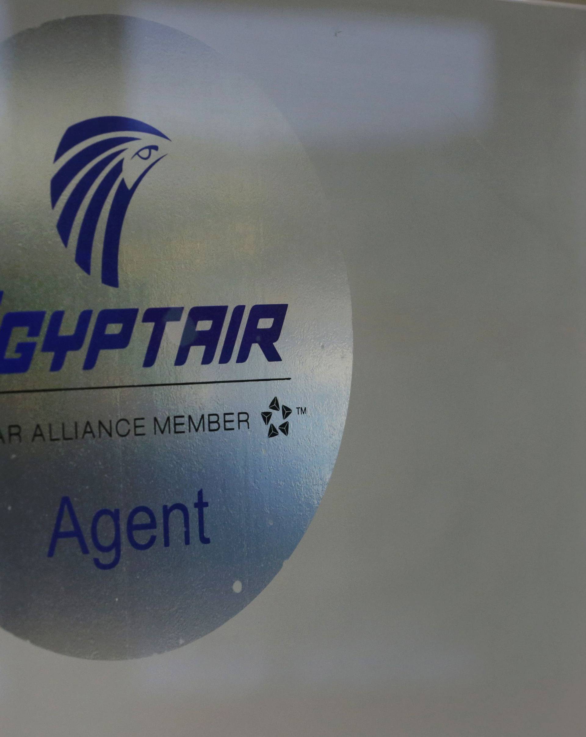 A man passes the Egyptair desk at Charles de Gaulle airport in Paris