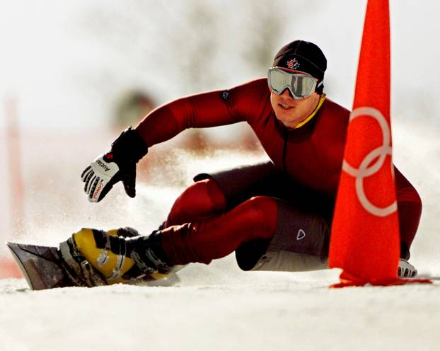 FILE PHOTO: Ryan Wedding of Canada in Olympic snowboard parallel giant slalom practice in 2002
