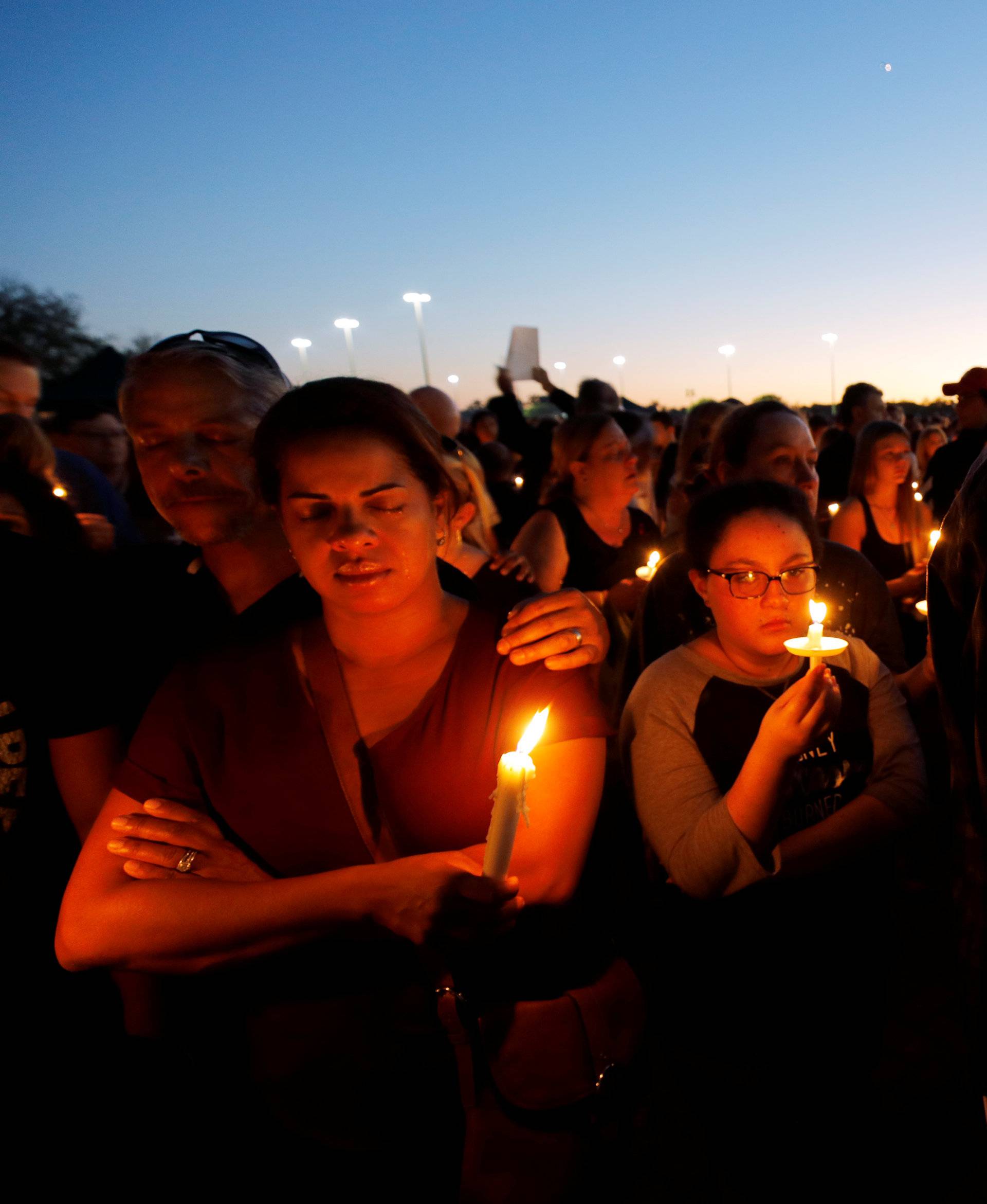 Residents attend a candlelight vigil the day after a shooting at Marjory Stoneman Douglas High School in Parkland