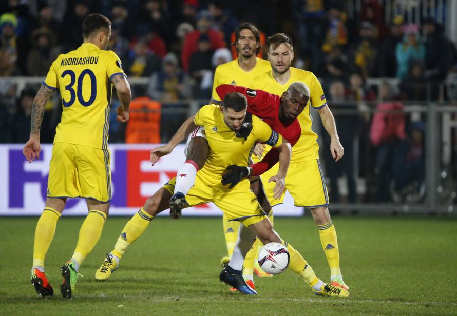 FC Rostov's Aleksandru Gatcan in action with Manchester United's Paul Pogba