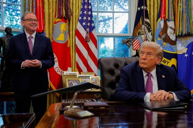 FILE PHOTO: U.S. President Donald Trump signs an executive order at the White House in Washington, D.C.