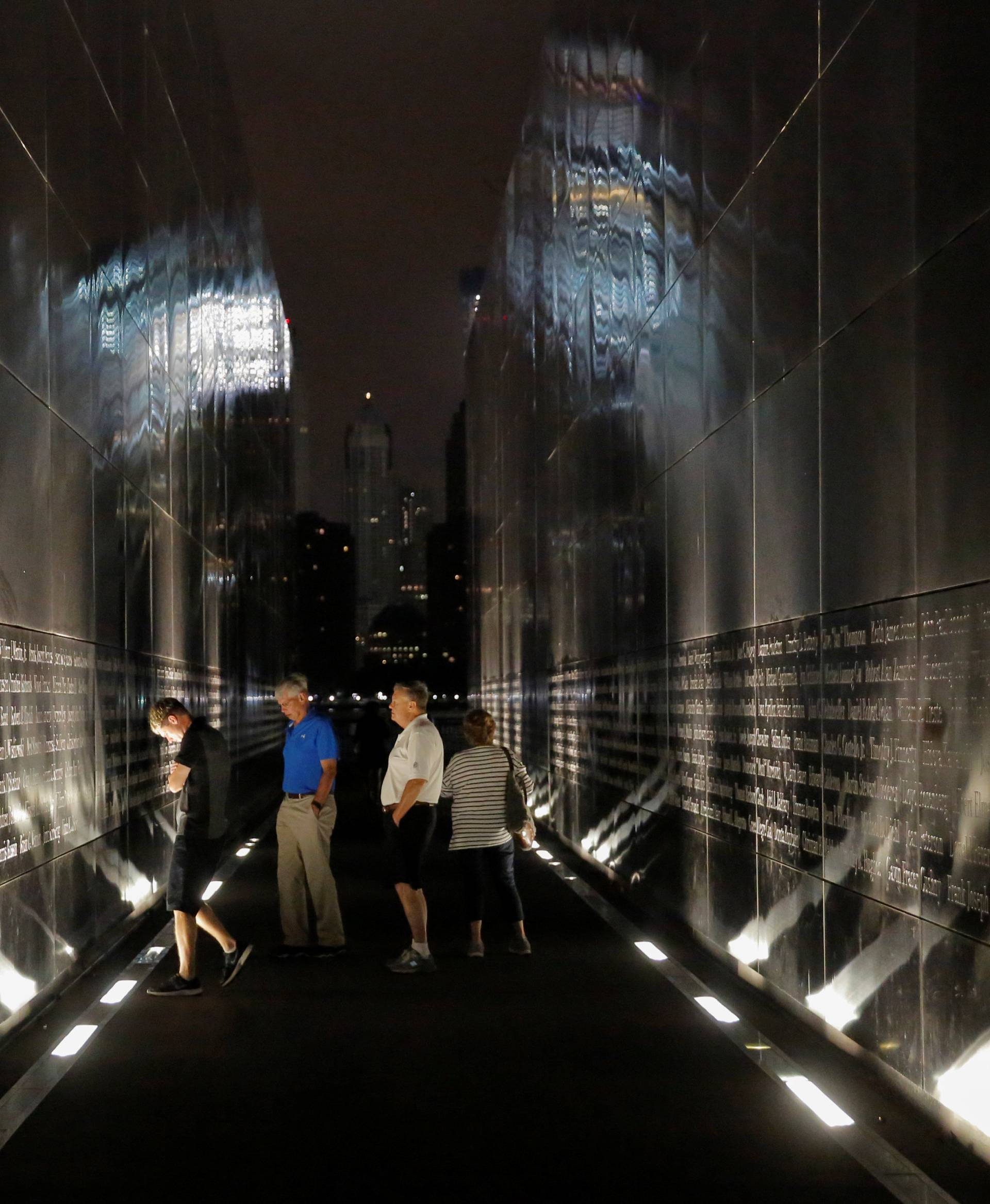 People gather at the Empty Sky memorial on the morning of the 15th anniversary of the 9/11 attacks in New Jersey
