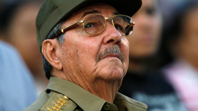 FILE PHOTO - Raul Castro looks up during an event in celebration of the 50th anniversary of the assault of the presidential palace during the regime of Fulgencio Batista, in Havana