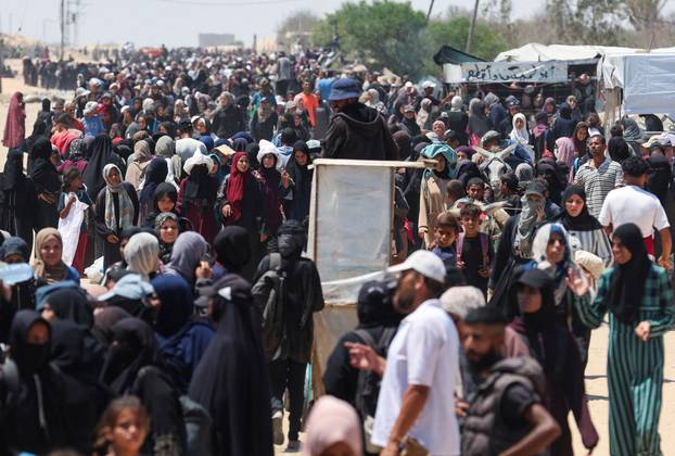 Palestinians seek aid from the U.S.-backed Gaza Humanitarian Foundation, near Rafah