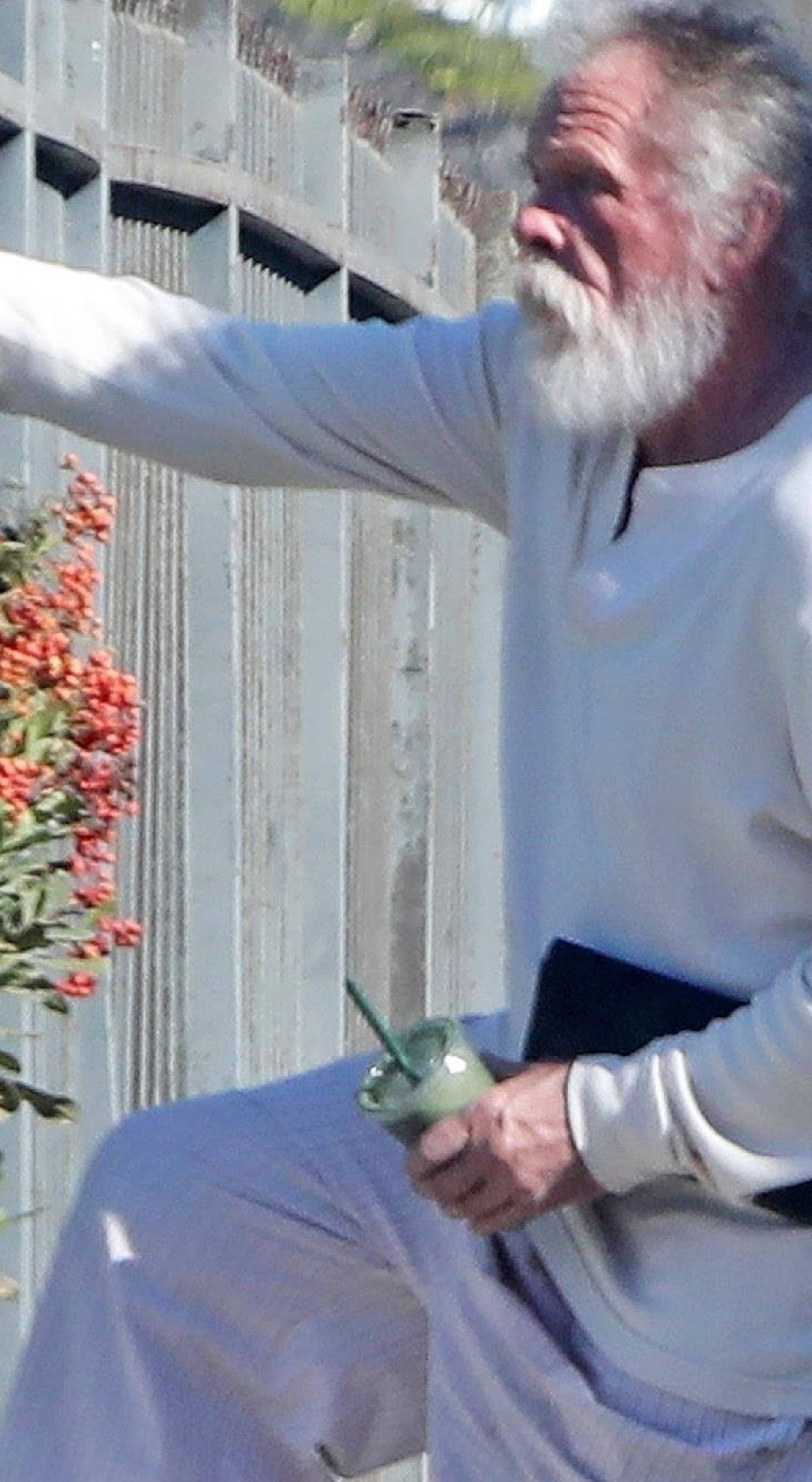 *EXCLUSIVE* Nick Nolte climbs a fence in his PJ's in Malibu