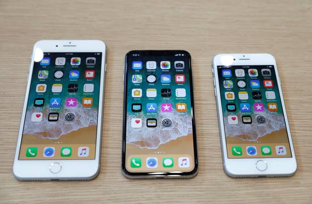 FILE PHOTO: Different iPhone 8 models are displayed during an Apple launch event in Cupertino