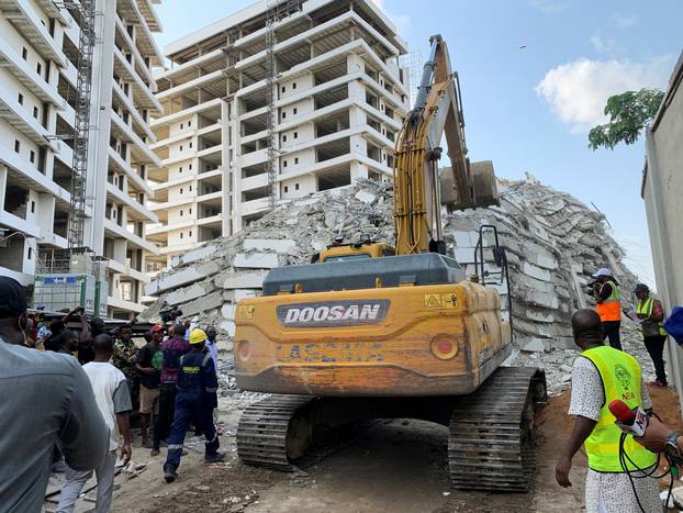 An excavator operates at the site of a collapsed building in Ikoyi, Lagos