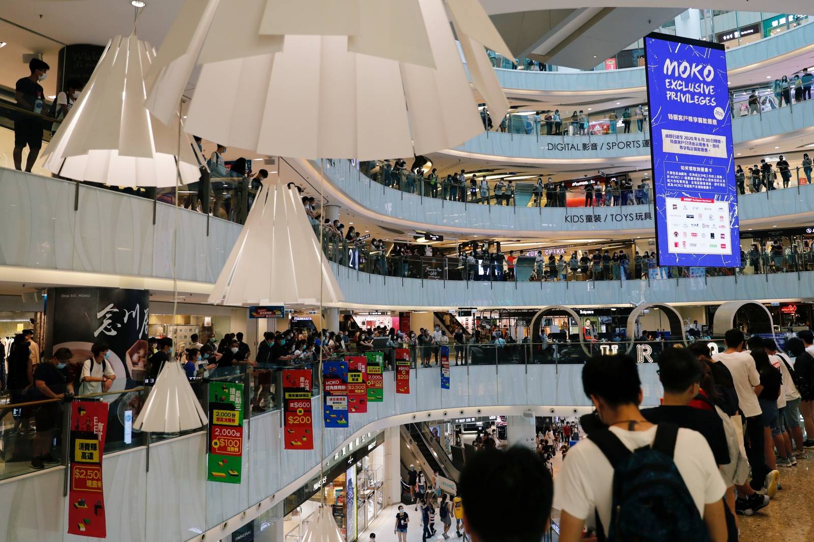 Anti-government protesters stage a rally at a shopping mall in Hong Kong