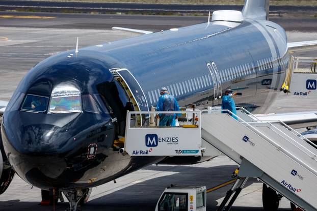 Passengers of the cruise ship MV Hondius, which was affected by a hantavirus outbreak, arrive at Tenerife Sud airport