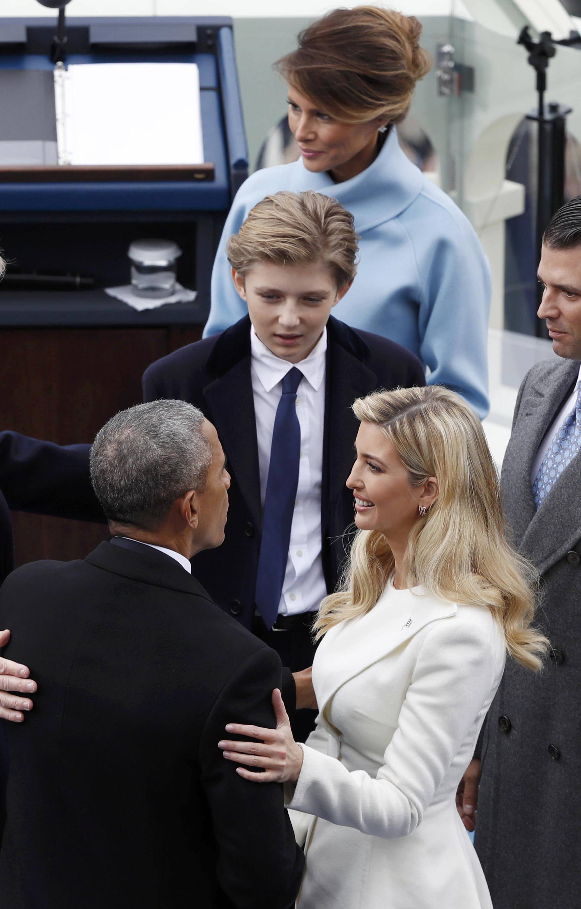 Former U.S. President Barack Obama speaks with Ivanka Trump and other members of the family of U.S. President Donald Trump during inauguration ceremonies in Washington