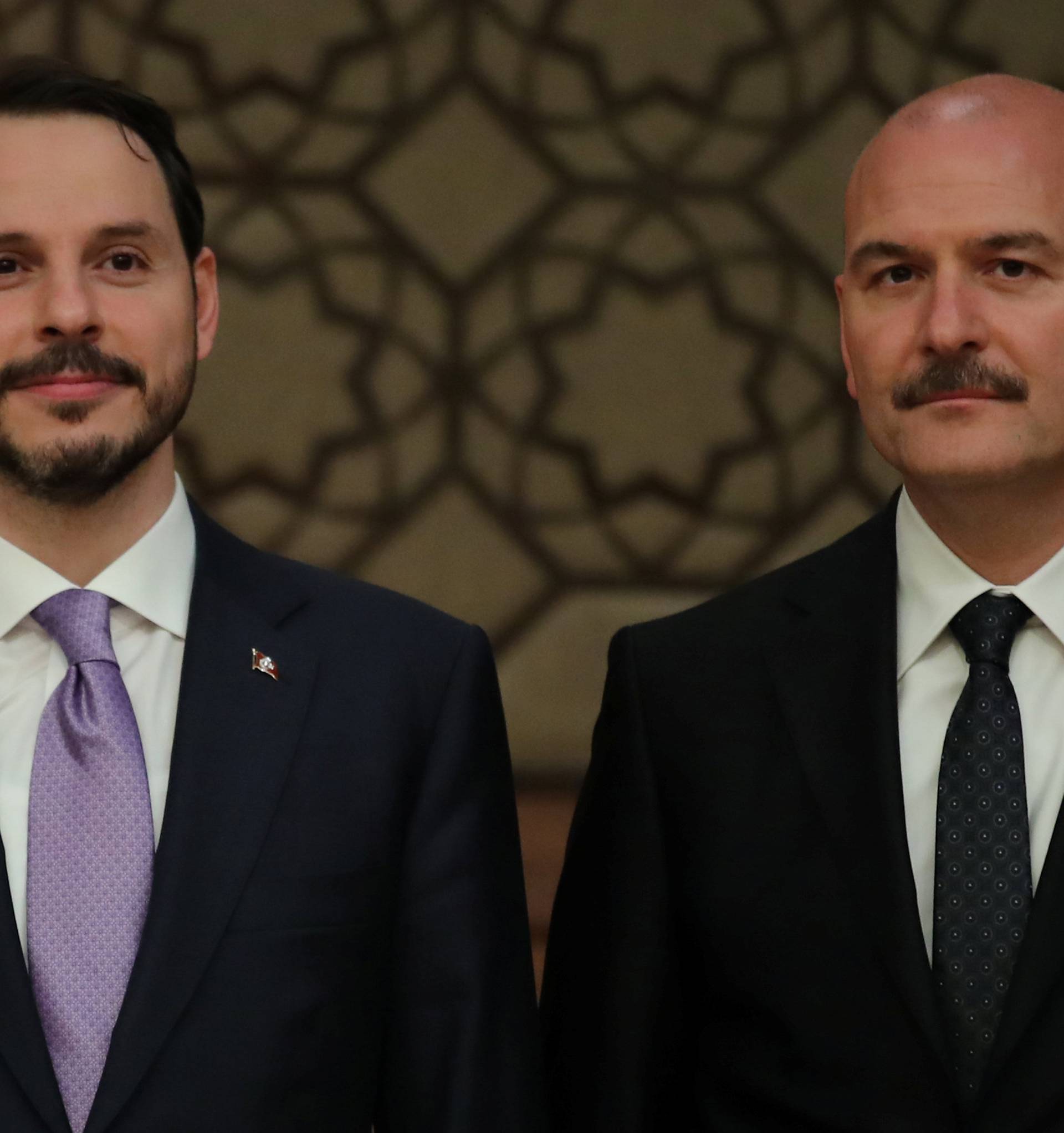 Turkish President Tayyip Erdogan's son-in-law and newly appointed Treasury and Finance Minister Berat Albayrak and Interior Minister Suleyman Soylu stand next to each other during a presser at the Presidential Palace in Ankara