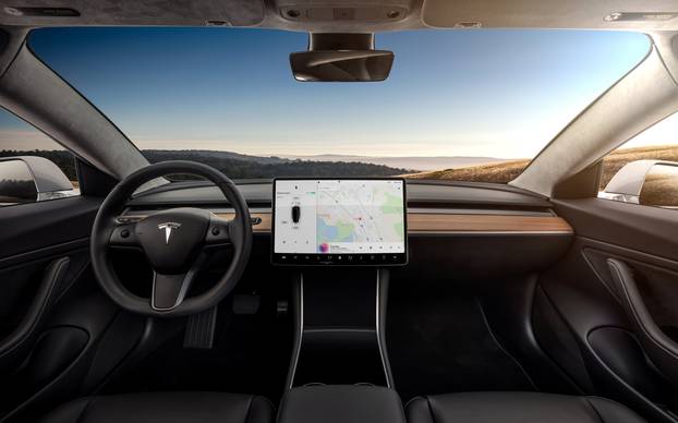 The interior of the Tesla Model 3 sedan is seen in this undated handout image as the car company handed over its first 30 Model 3 vehicles to employee buyers at the companyâs Fremont facility