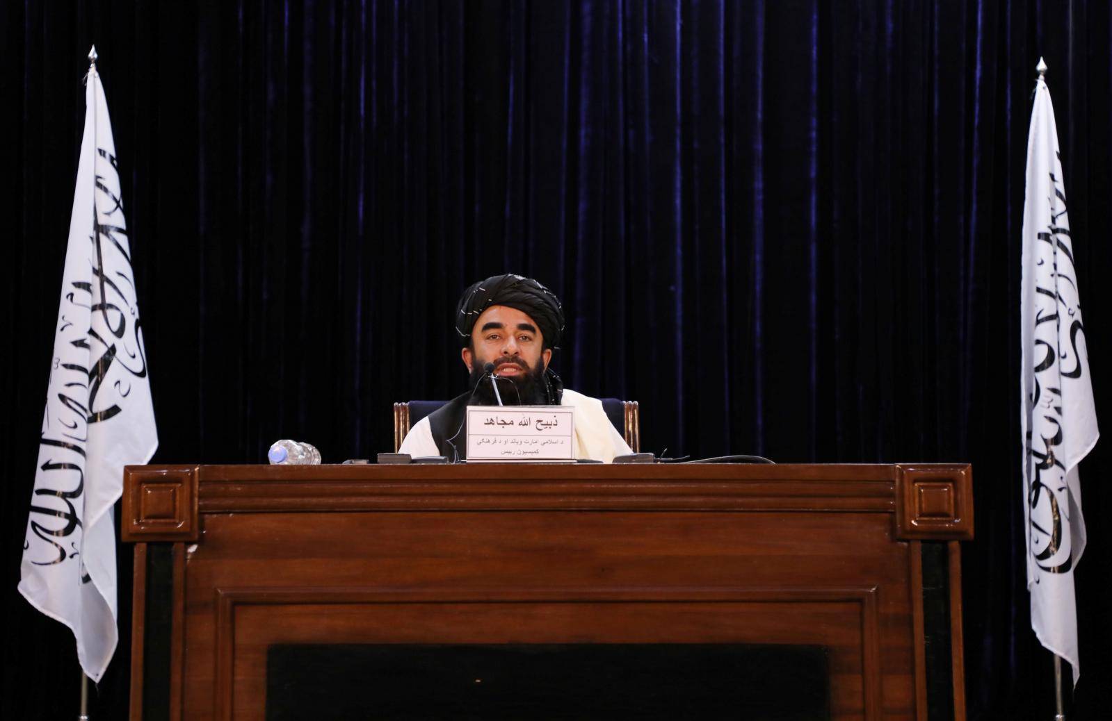 Taliban spokesman Zabihullah Mujahid speaks during a news conference in Kabul